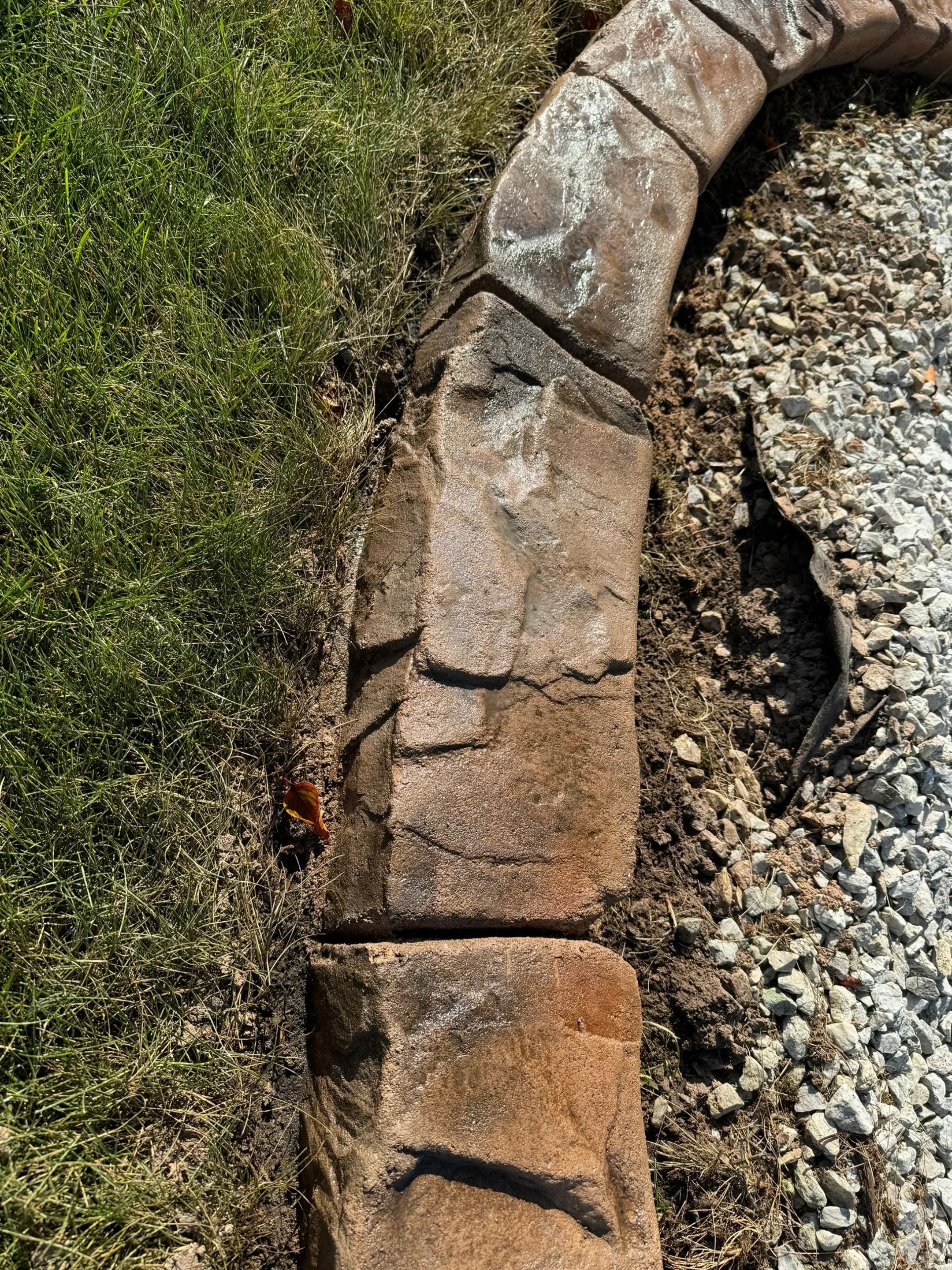 Stamped concrete curbing with brick pattern