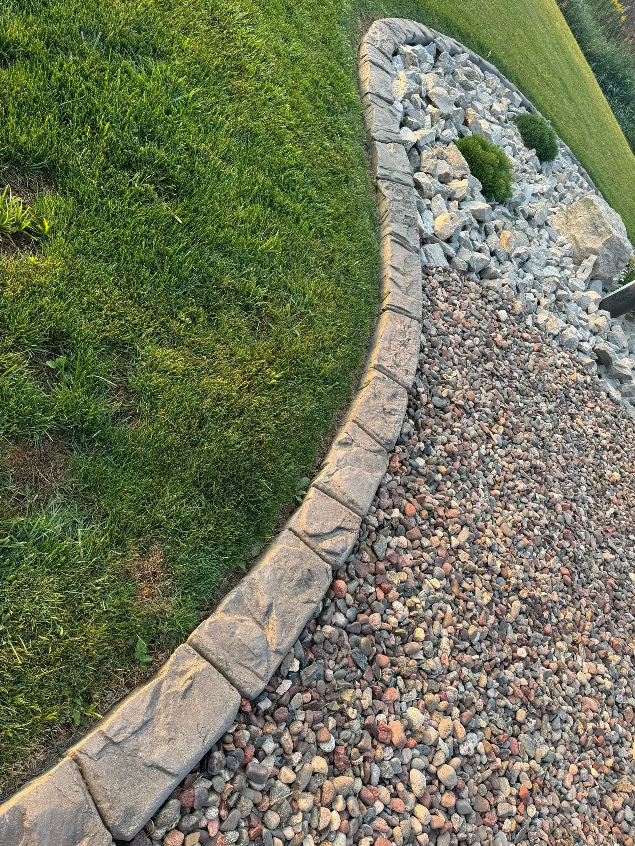 Continuous curbing along driveway edge
