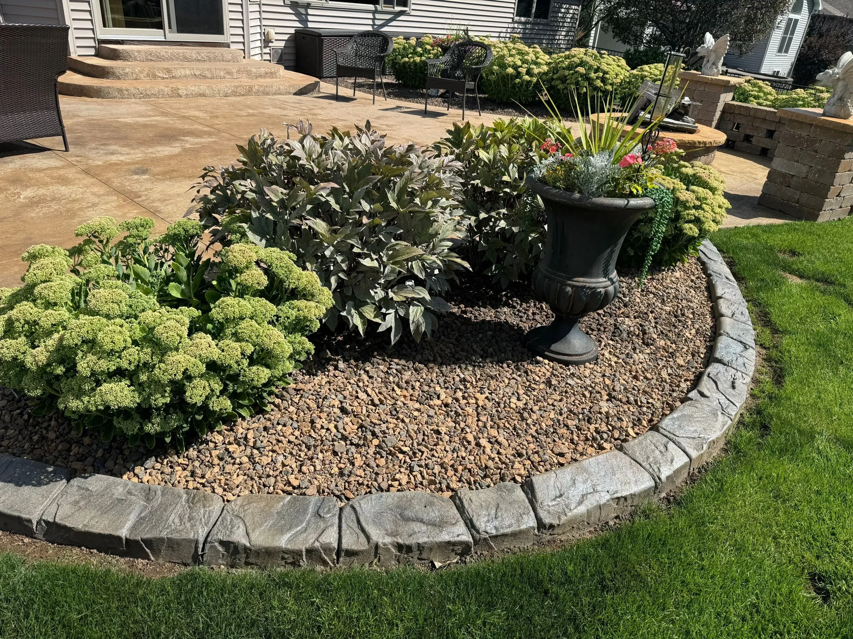 Curved flower bed edging at golden hour