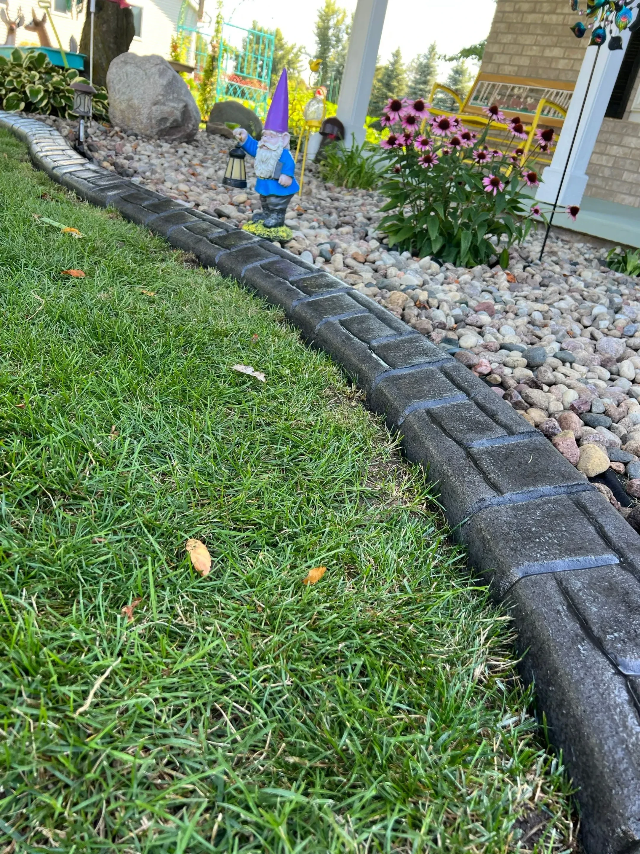 Repaired concrete curbing section